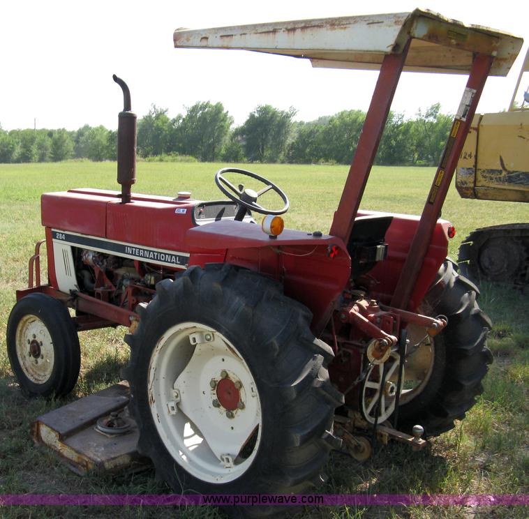 image for item 5065 International 284 tractor with 72" belly mower
