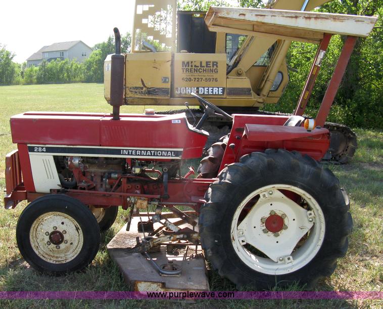 image for item 5065 International 284 tractor with 72" belly mower