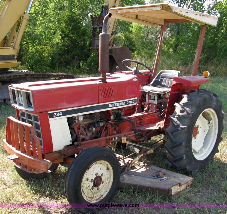 image for item 5065 International 284 tractor with 72" belly mower