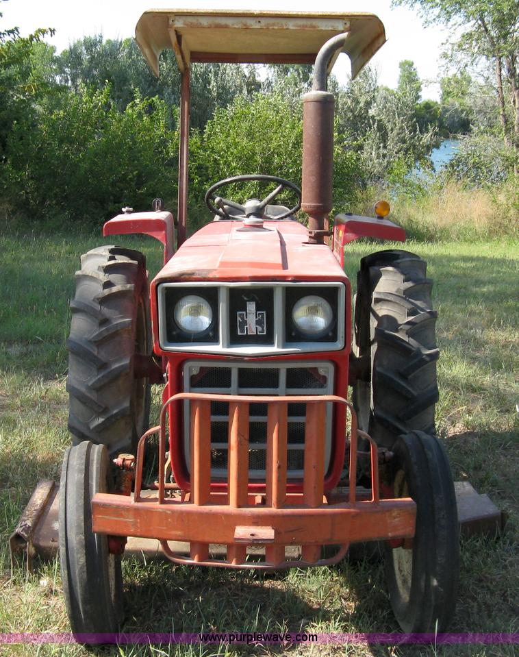 image for item 5065 International 284 tractor with 72" belly mower