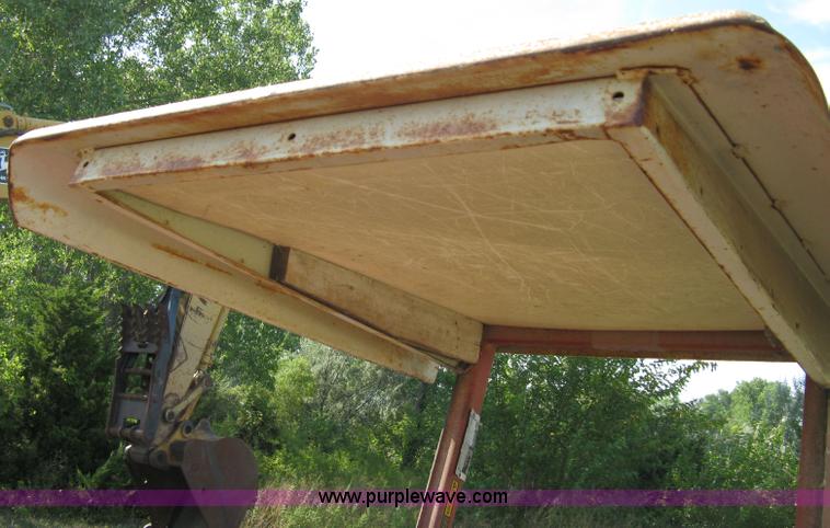 image for item 5065 International 284 tractor with 72" belly mower