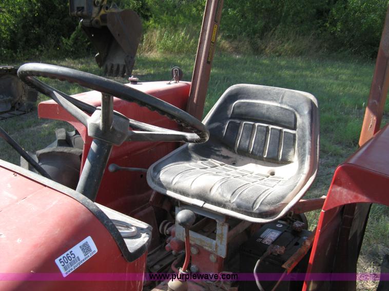 image for item 5065 International 284 tractor with 72" belly mower