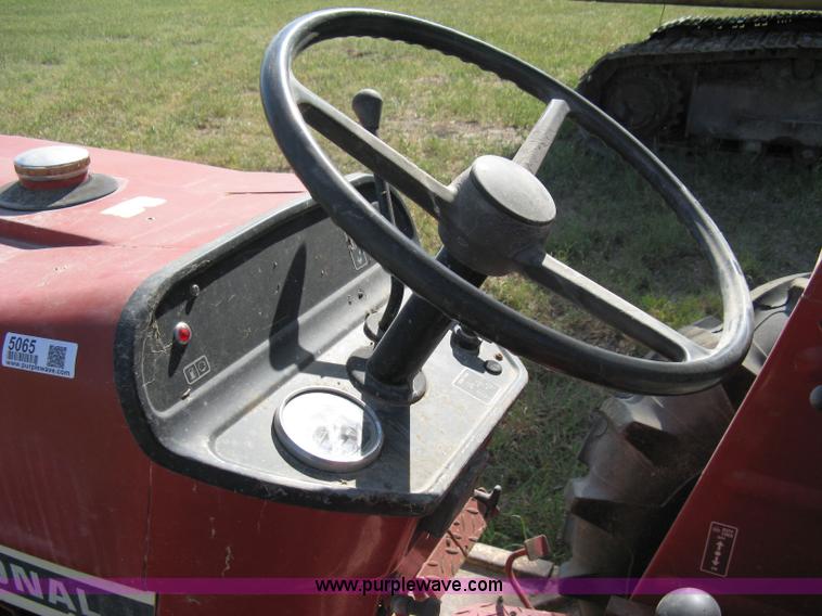 image for item 5065 International 284 tractor with 72" belly mower