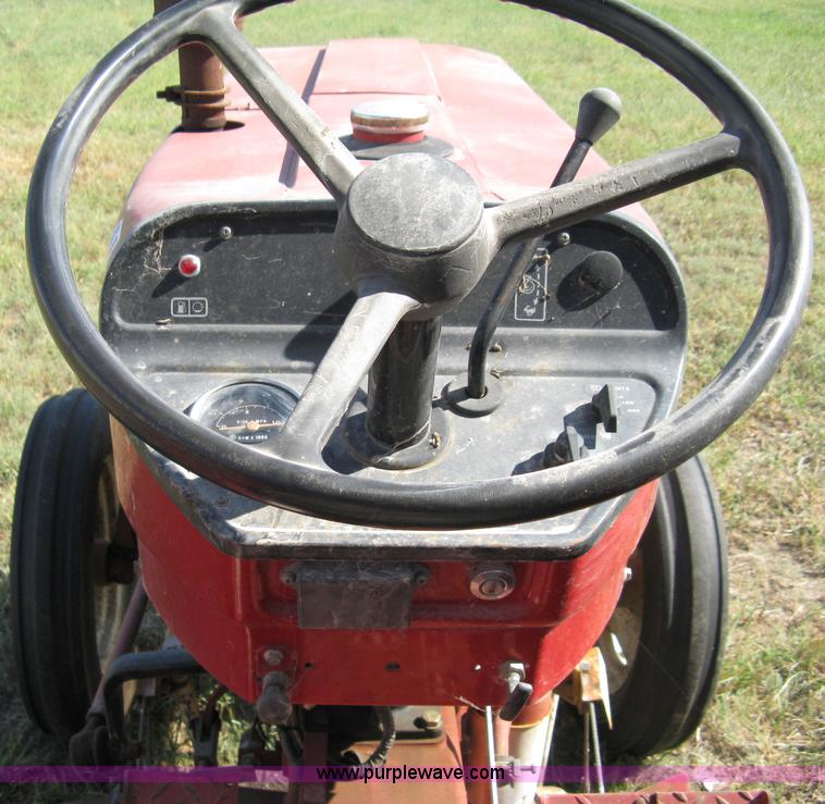 image for item 5065 International 284 tractor with 72" belly mower