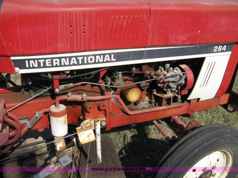 image for item 5065 International 284 tractor with 72" belly mower