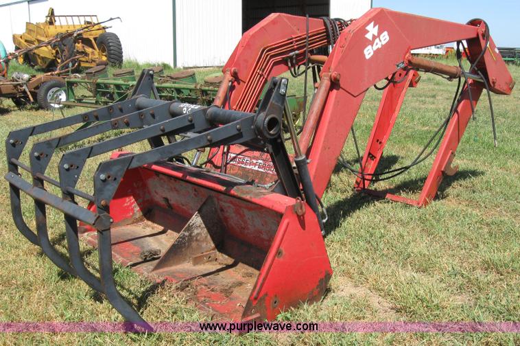image for item 2659 Massey-Ferguson 848 loader with Dual 94 grapple