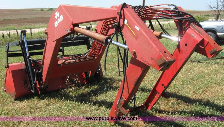 image for item 2659 Massey-Ferguson 848 loader with Dual 94 grapple