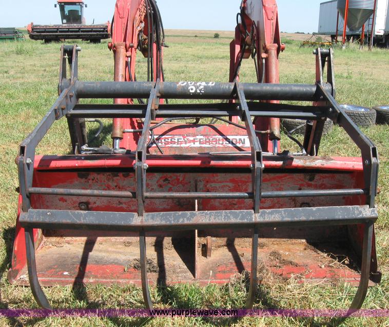 image for item 2659 Massey-Ferguson 848 loader with Dual 94 grapple