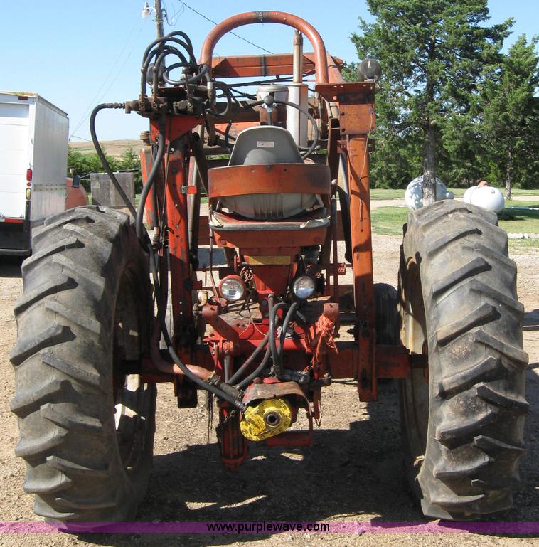 image for item 2692 Farmall 460 tractor with Farmhand F-11 loader and bale grapple