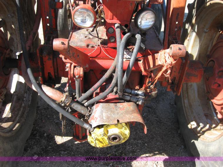 image for item 2692 Farmall 460 tractor with Farmhand F-11 loader and bale grapple