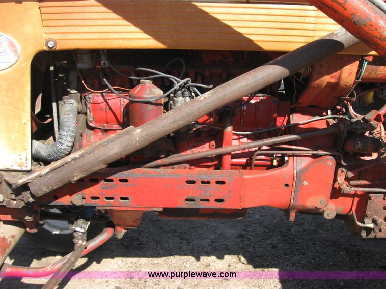 image for item 2692 Farmall 460 tractor with Farmhand F-11 loader and bale grapple