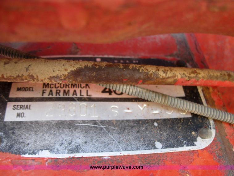 image for item 2692 Farmall 460 tractor with Farmhand F-11 loader and bale grapple