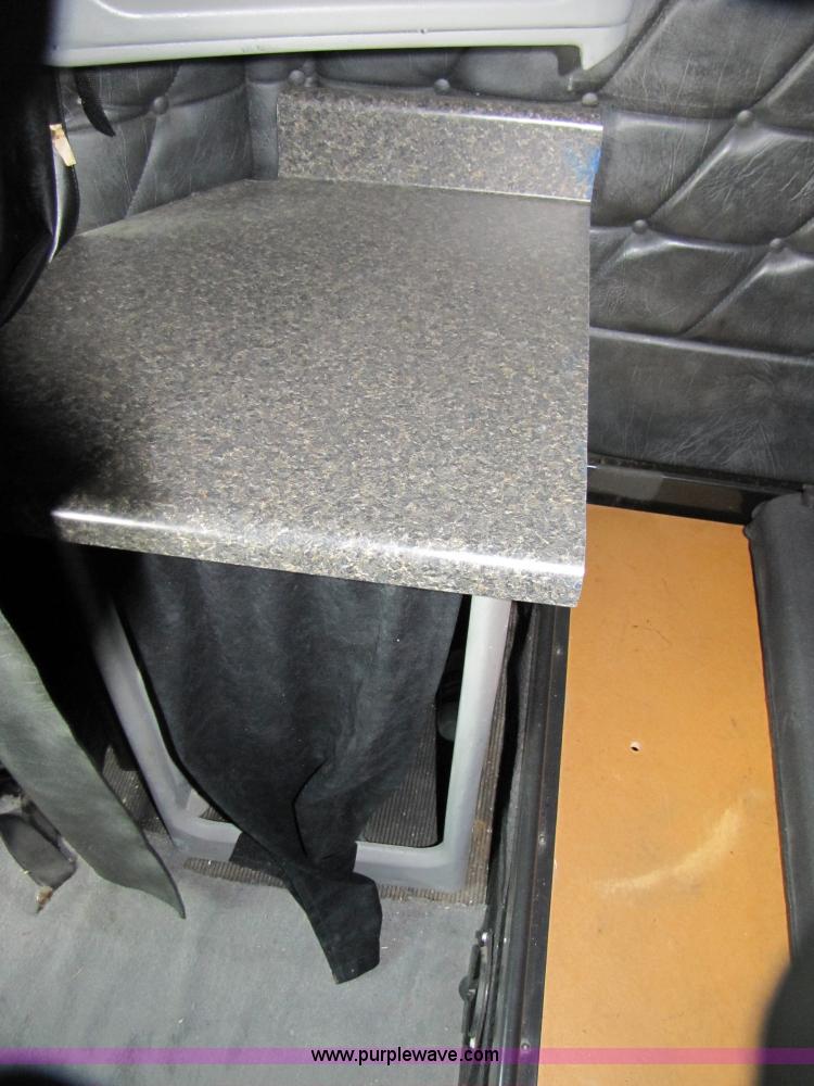 image for item 3090 2003 Freightliner Conventional FLD132 XL Classic semi truck