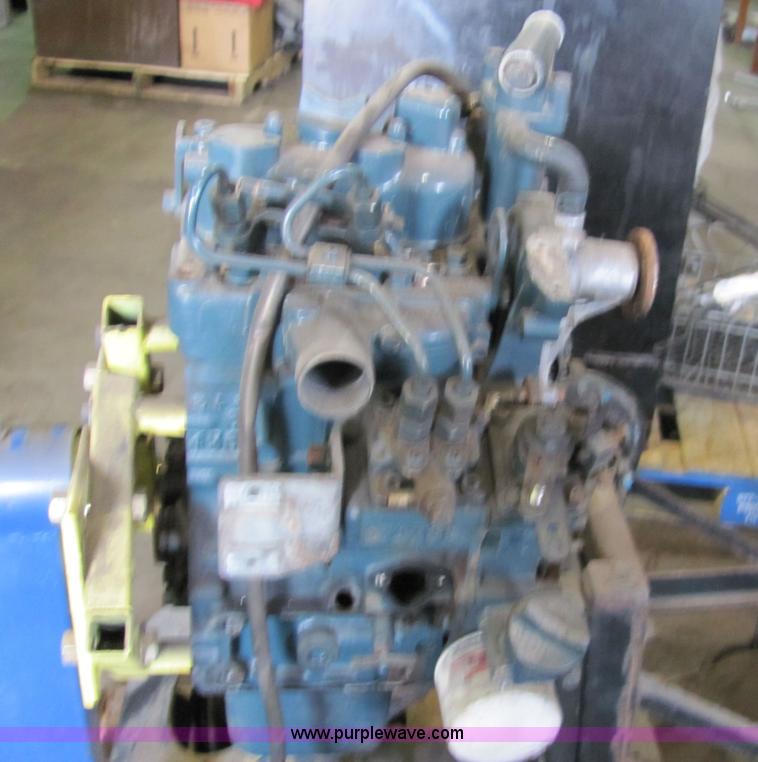 image for item 2194 Cummins 750 lbs capacity engine stand with Kubota engine and assorted parts