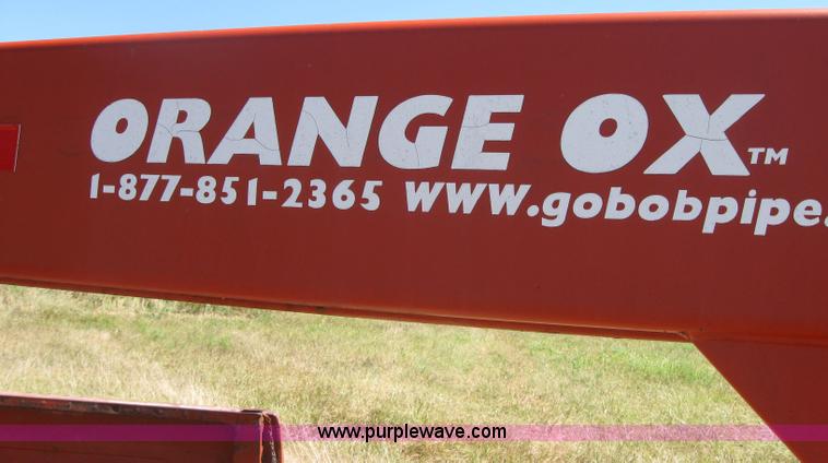 image for item 2764 Orange Ox round bale trailer