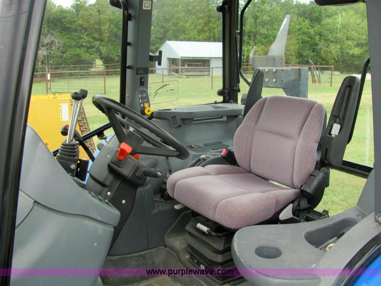 image for item 6942 2002 New Holland TS100 tractor with side-boom mower