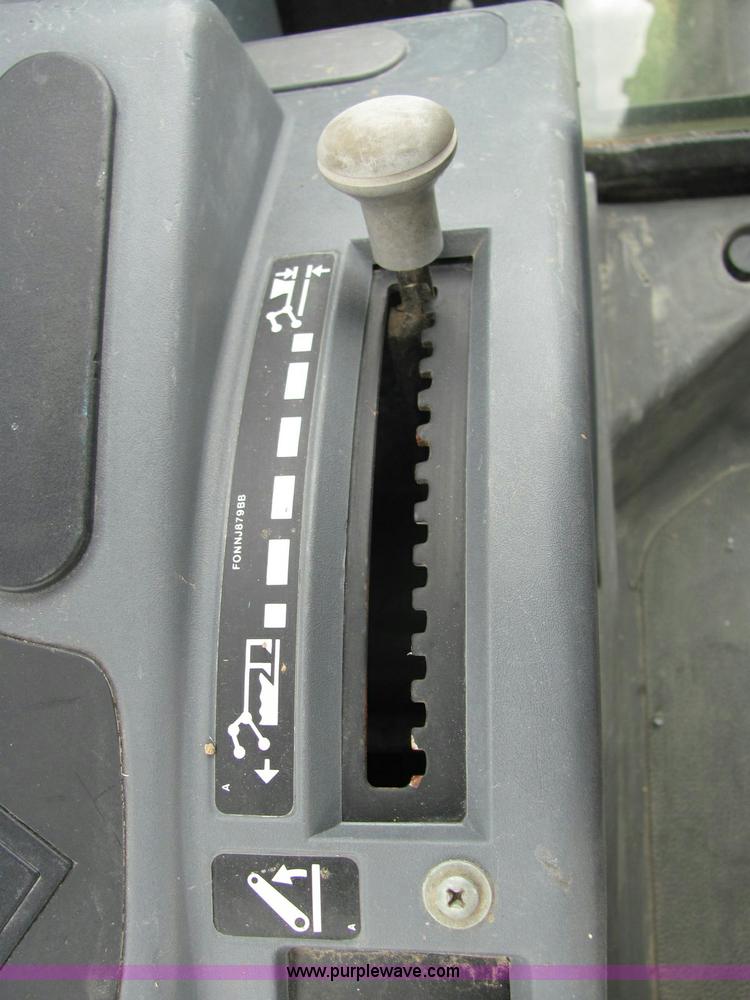 image for item 6942 2002 New Holland TS100 tractor with side-boom mower