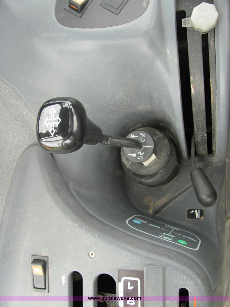 image for item 6942 2002 New Holland TS100 tractor with side-boom mower