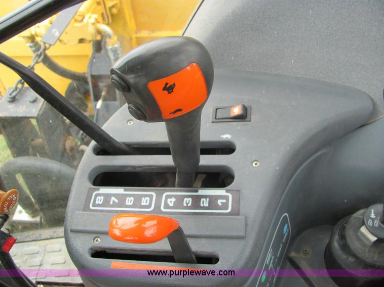 image for item 6942 2002 New Holland TS100 tractor with side-boom mower