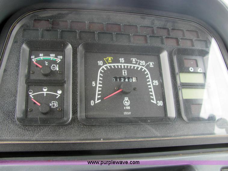 image for item 6942 2002 New Holland TS100 tractor with side-boom mower