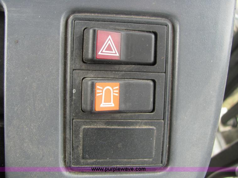 image for item 6942 2002 New Holland TS100 tractor with side-boom mower