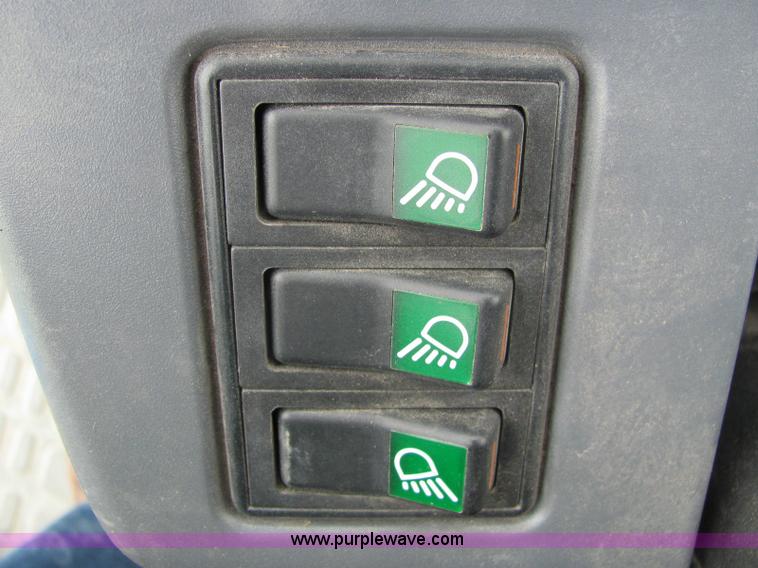 image for item 6942 2002 New Holland TS100 tractor with side-boom mower