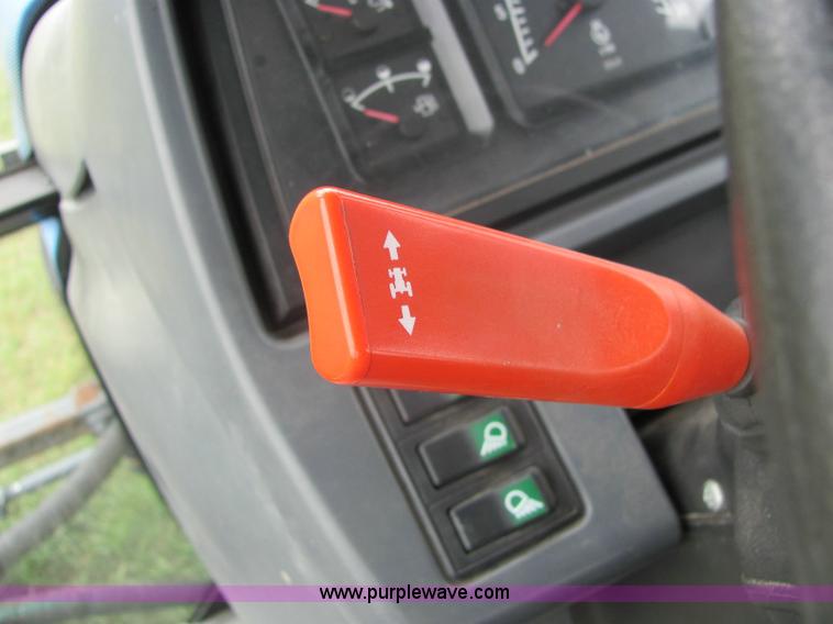 image for item 6942 2002 New Holland TS100 tractor with side-boom mower