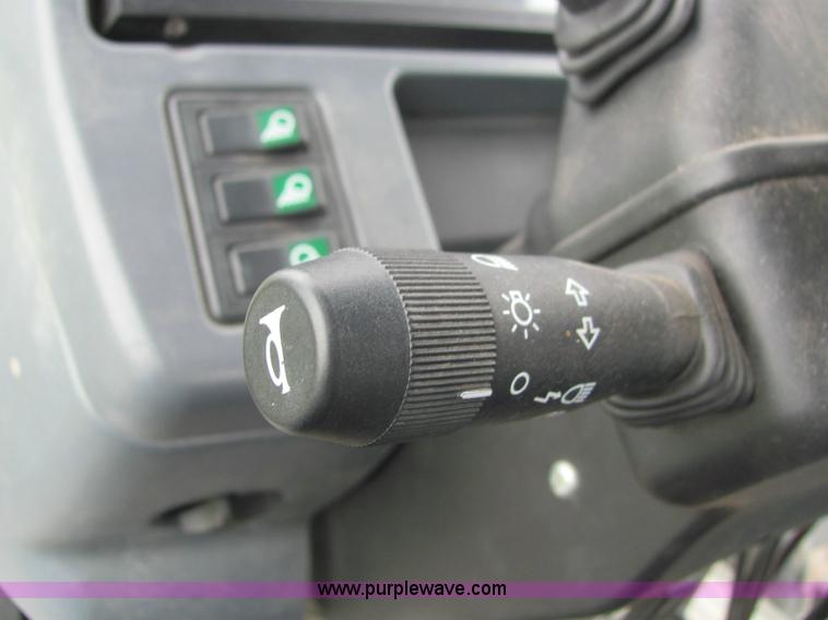 image for item 6942 2002 New Holland TS100 tractor with side-boom mower