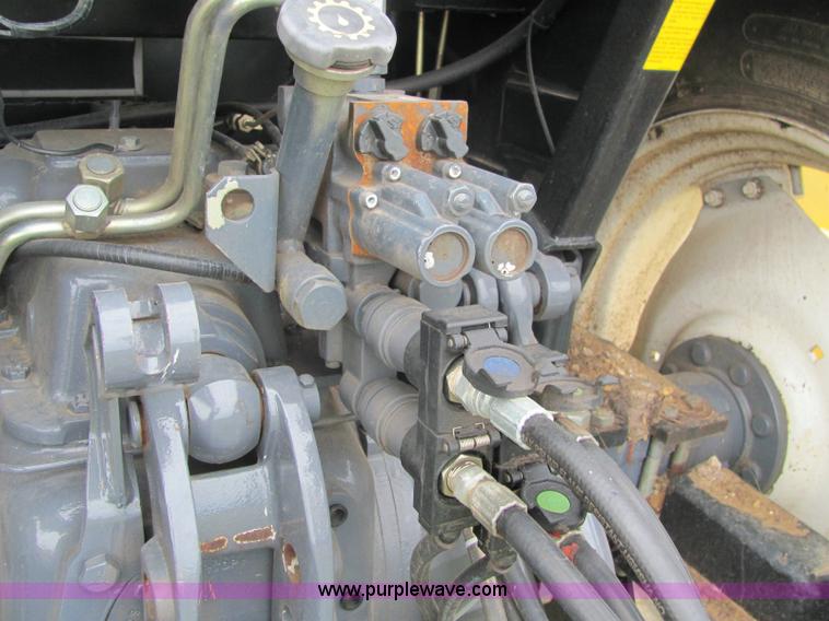 image for item 6942 2002 New Holland TS100 tractor with side-boom mower