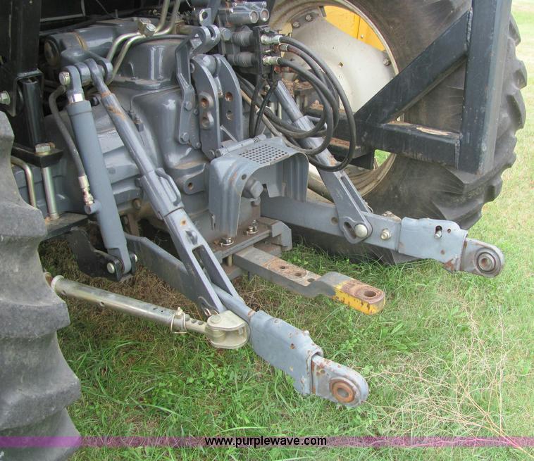 image for item 6942 2002 New Holland TS100 tractor with side-boom mower