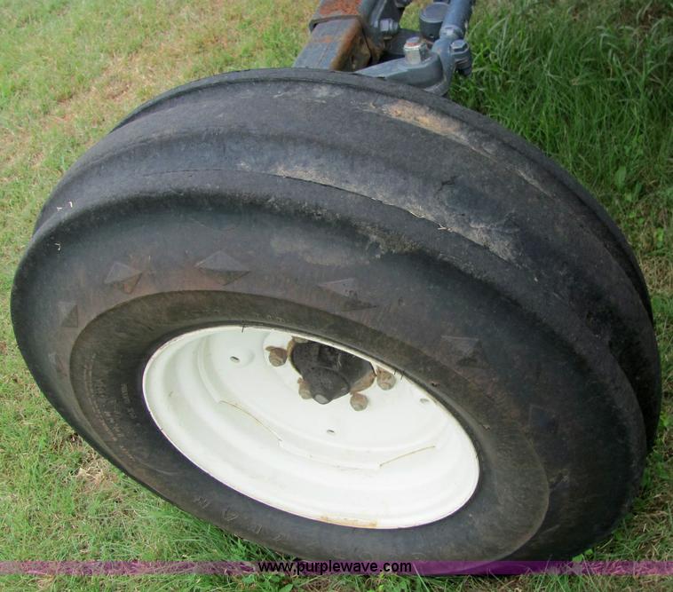 image for item 6942 2002 New Holland TS100 tractor with side-boom mower