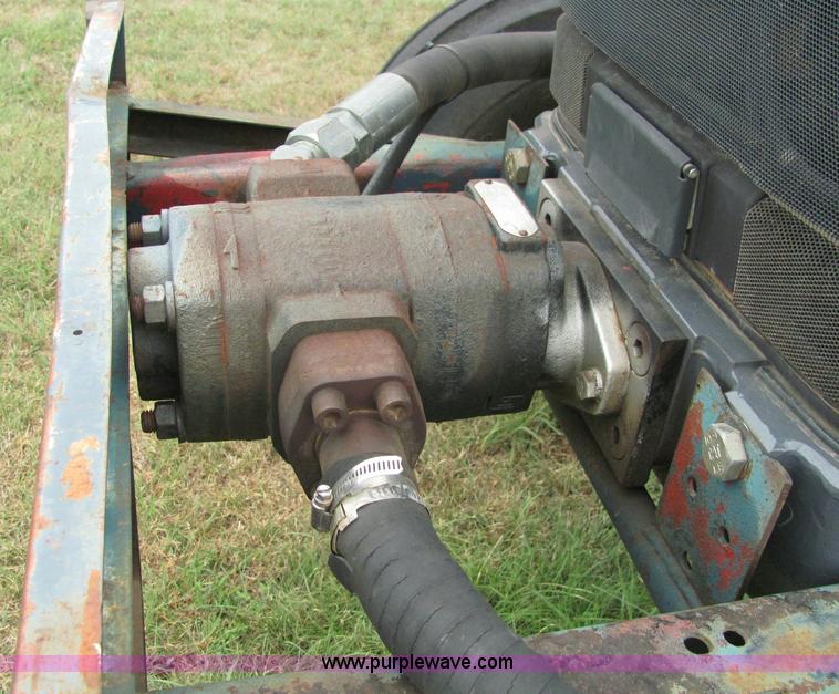 image for item 6942 2002 New Holland TS100 tractor with side-boom mower