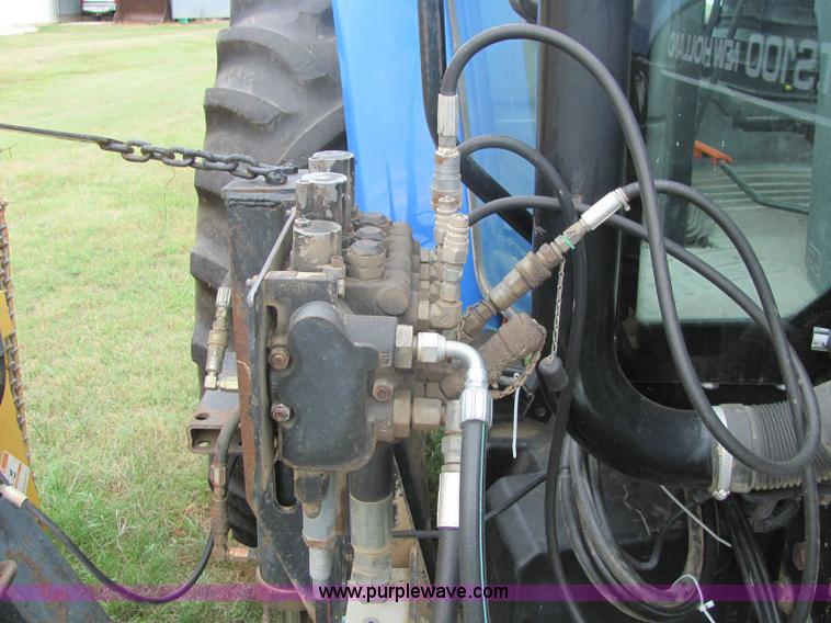 image for item 6942 2002 New Holland TS100 tractor with side-boom mower