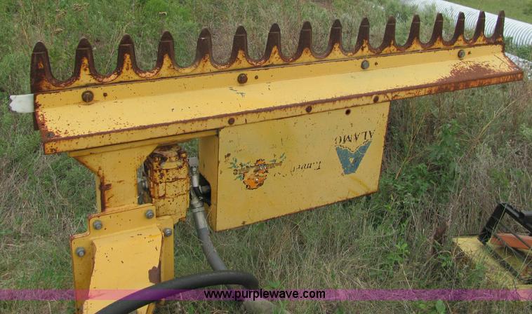 image for item 6942 2002 New Holland TS100 tractor with side-boom mower