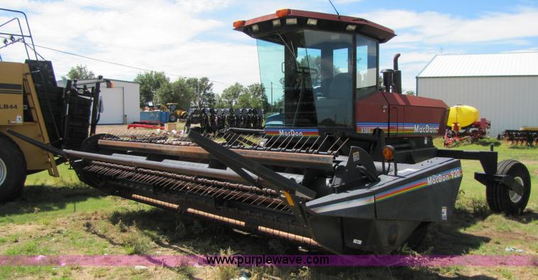 image for item 3142 1998 Mac Don self-propelled windrower with Mac Don 16'auger head