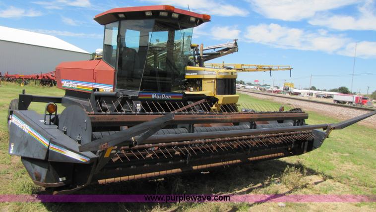image for item 3142 1998 Mac Don self-propelled windrower with Mac Don 16'auger head