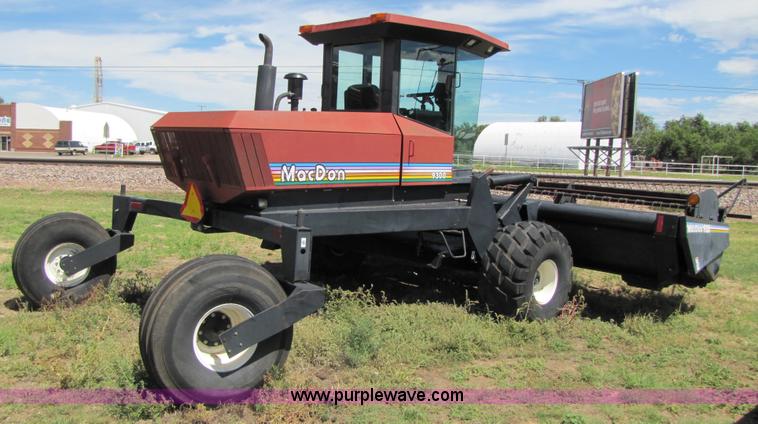 image for item 3142 1998 Mac Don self-propelled windrower with Mac Don 16'auger head
