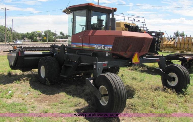 image for item 3142 1998 Mac Don self-propelled windrower with Mac Don 16'auger head