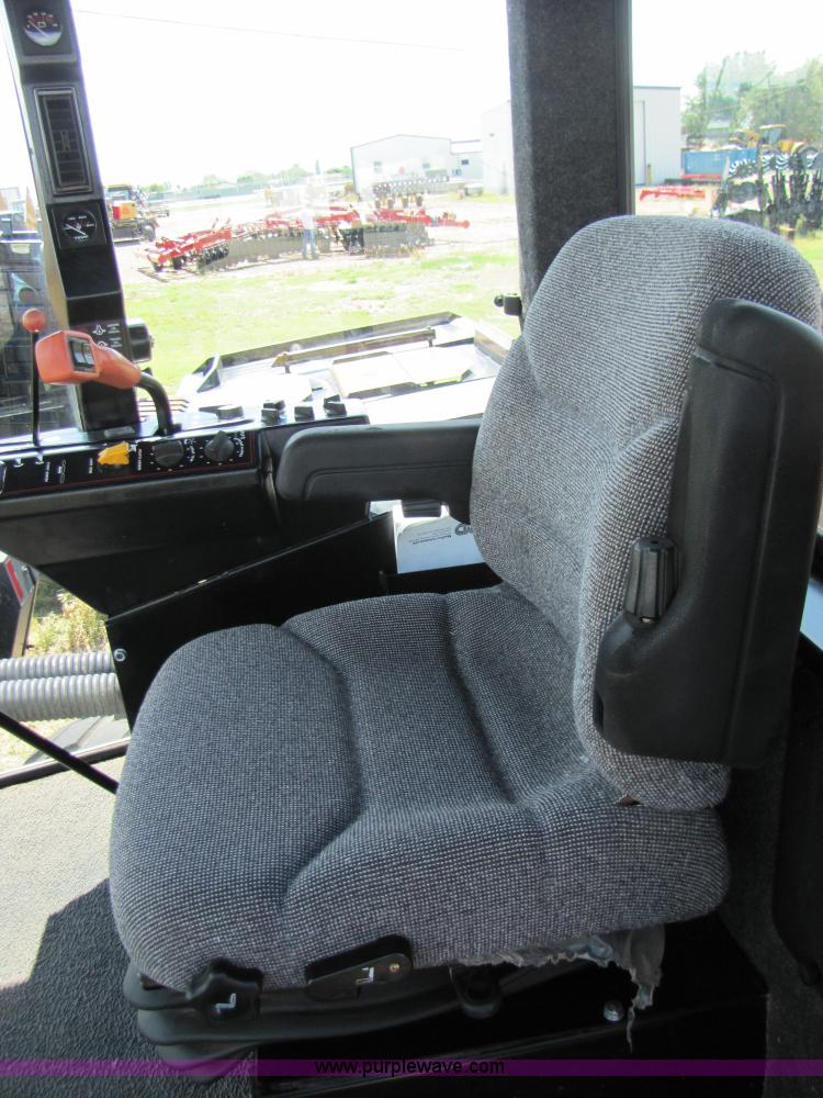 image for item 3142 1998 Mac Don self-propelled windrower with Mac Don 16'auger head