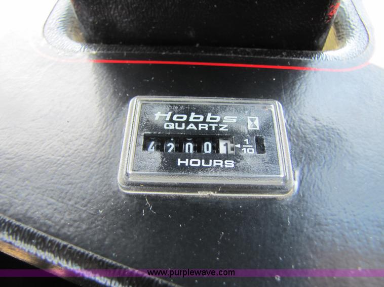 image for item 3142 1998 Mac Don self-propelled windrower with Mac Don 16'auger head