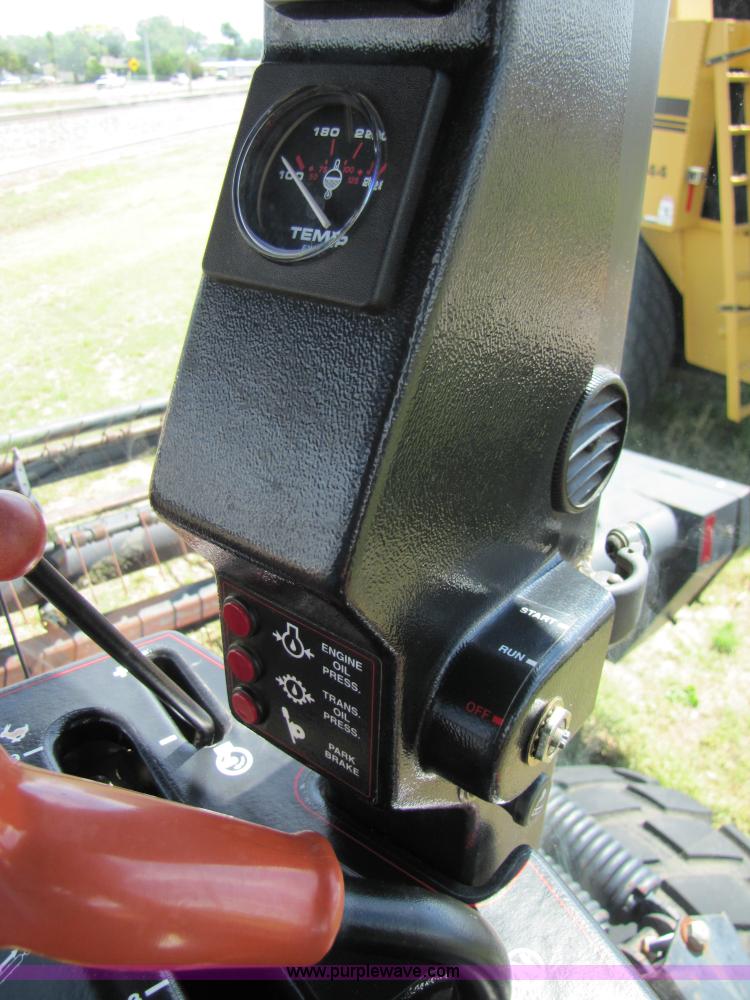 image for item 3142 1998 Mac Don self-propelled windrower with Mac Don 16'auger head