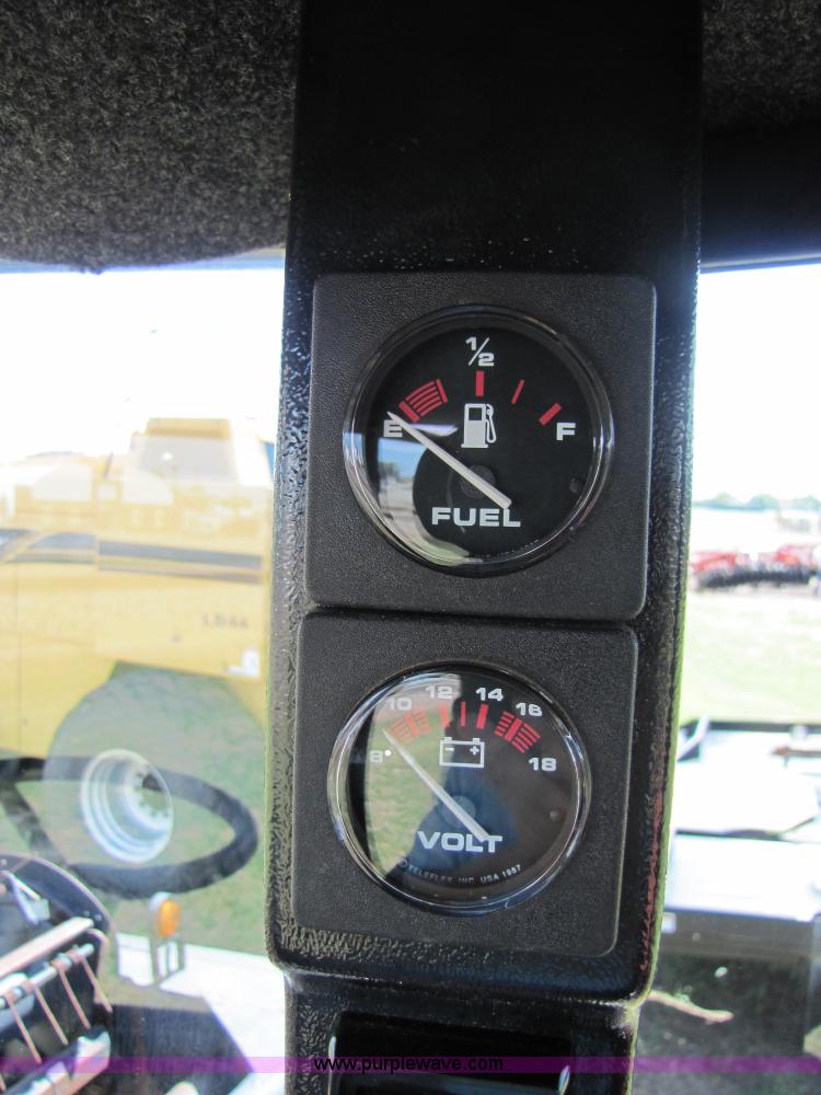 image for item 3142 1998 Mac Don self-propelled windrower with Mac Don 16'auger head