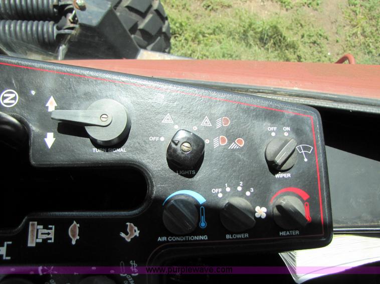 image for item 3142 1998 Mac Don self-propelled windrower with Mac Don 16'auger head