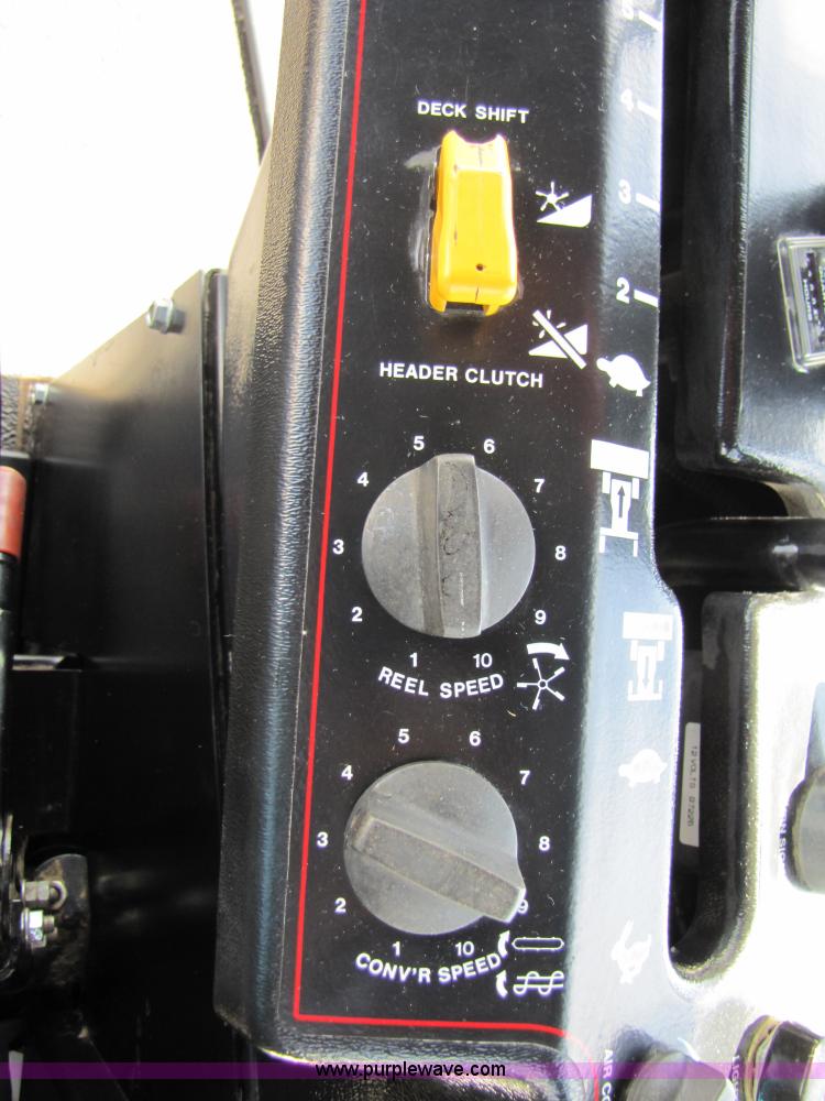 image for item 3142 1998 Mac Don self-propelled windrower with Mac Don 16'auger head