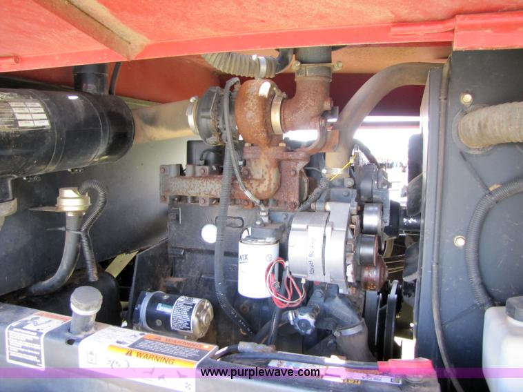 image for item 3142 1998 Mac Don self-propelled windrower with Mac Don 16'auger head