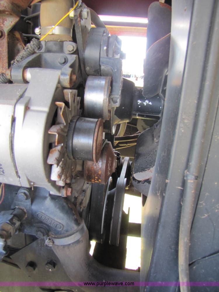 image for item 3142 1998 Mac Don self-propelled windrower with Mac Don 16'auger head