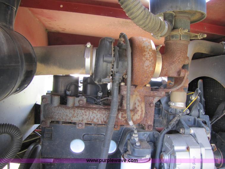 image for item 3142 1998 Mac Don self-propelled windrower with Mac Don 16'auger head