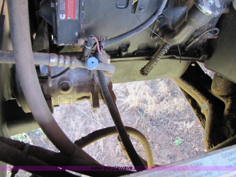 image for item 3142 1998 Mac Don self-propelled windrower with Mac Don 16'auger head