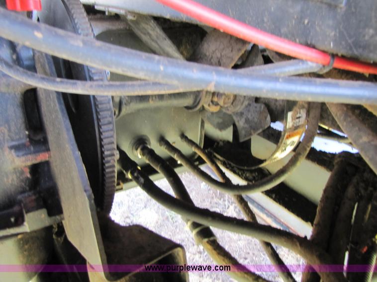 image for item 3142 1998 Mac Don self-propelled windrower with Mac Don 16'auger head