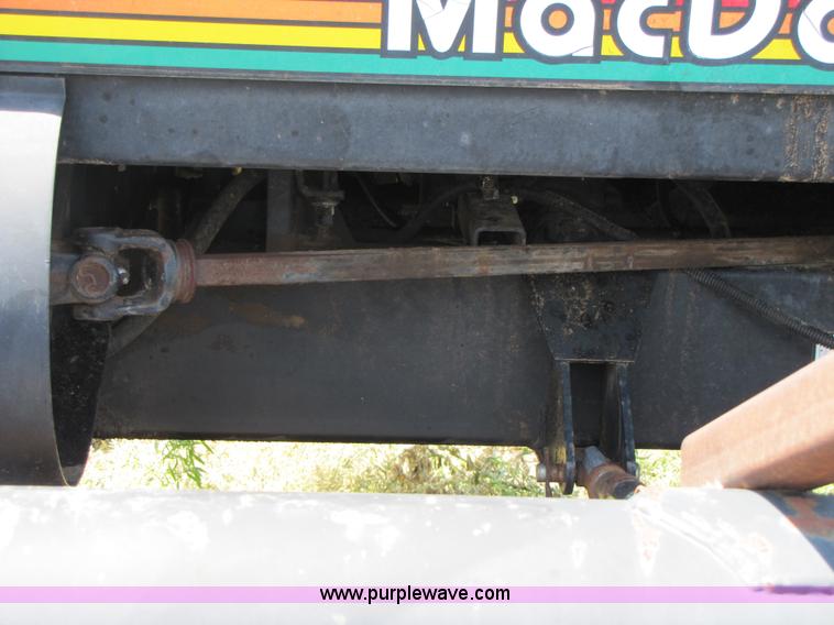 image for item 3142 1998 Mac Don self-propelled windrower with Mac Don 16'auger head